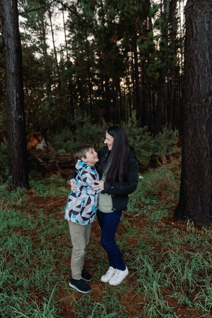 amy green photographer cape town with son in a forest