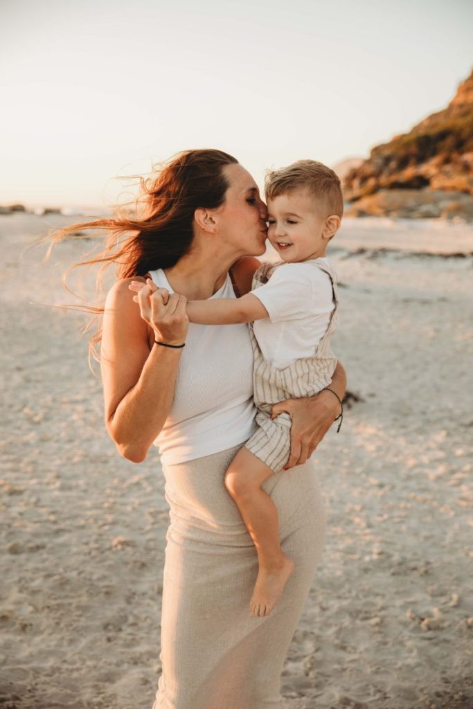 family giggling and laughing together during golden hour 