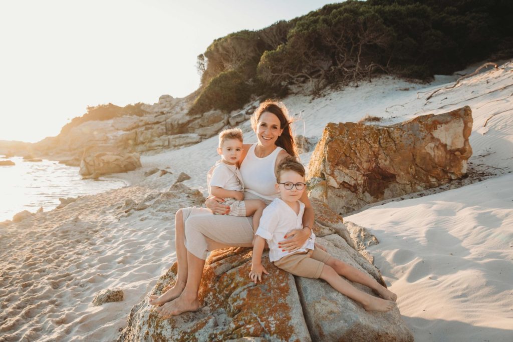 family giggling and laughing together during golden hour 