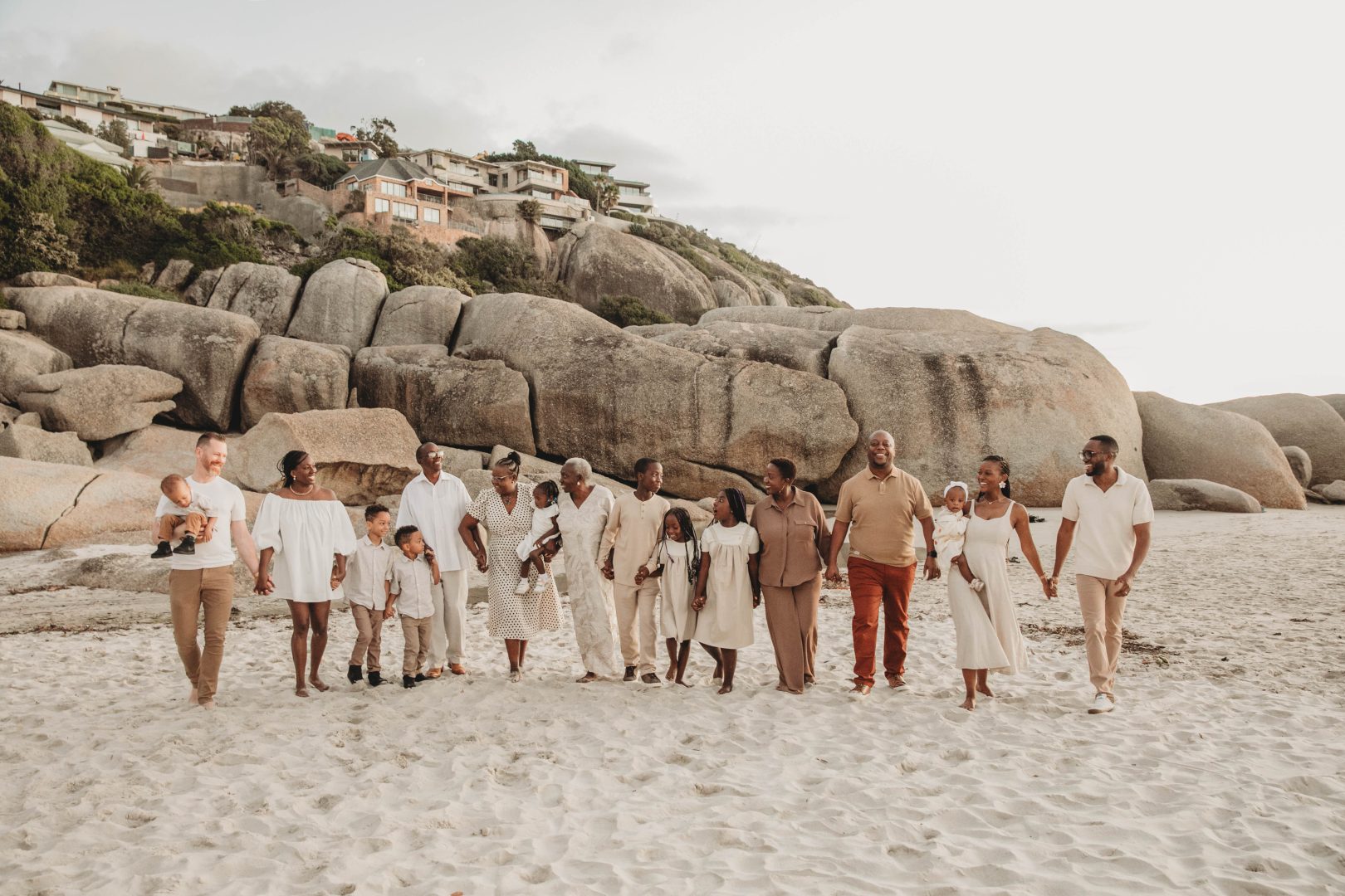 large African family on Llandudno beach in cape town at a photo shoot