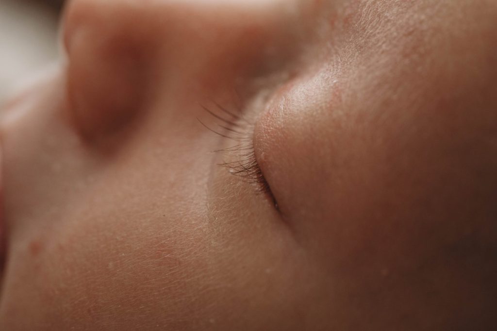 Close-up photo of a newborn baby’s eye lashes in a posed studio setup, Cape Town photographer