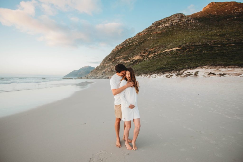 Cape Town maternity photographer capturing couple on Noordhoek Beach