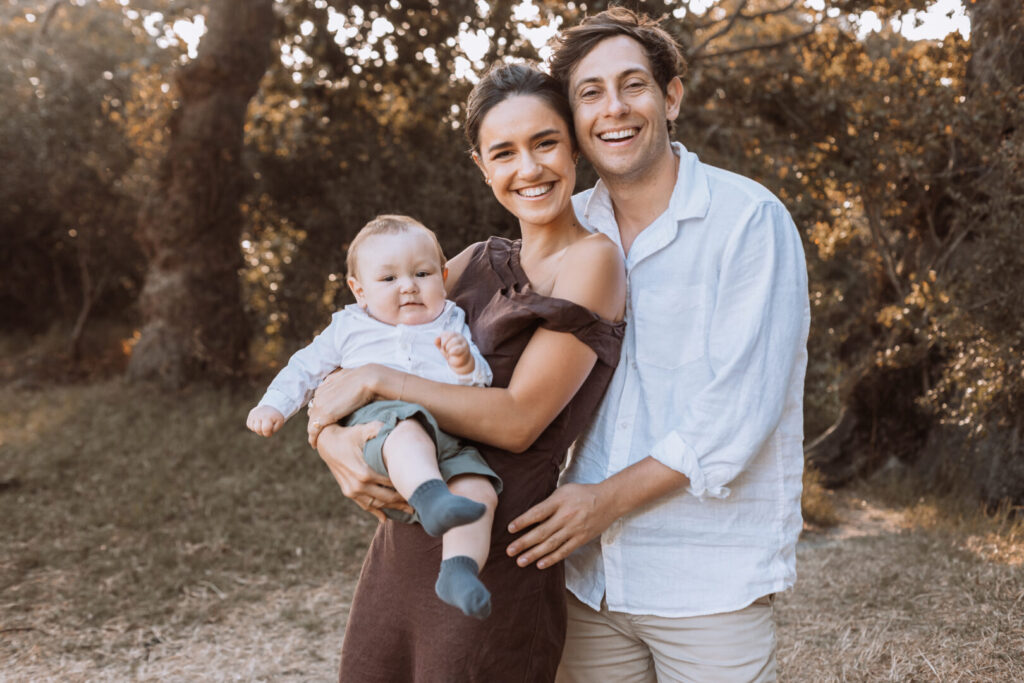Uncle holding baby during Cape Town beach family photoshoot