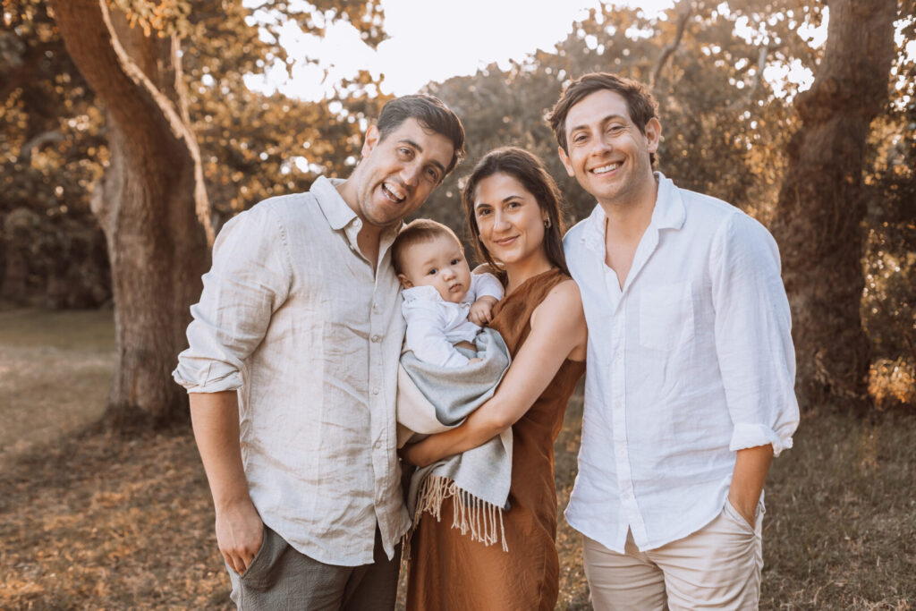 Uncle holding baby during Cape Town beach family photoshoot