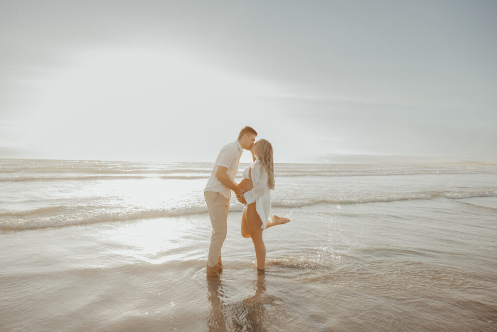 wide angel maternity pictures on the beach at sunset