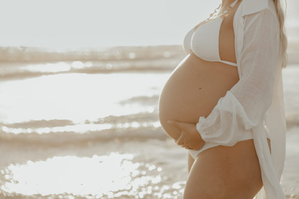 pregnancy belly on the beach during sunset cape town